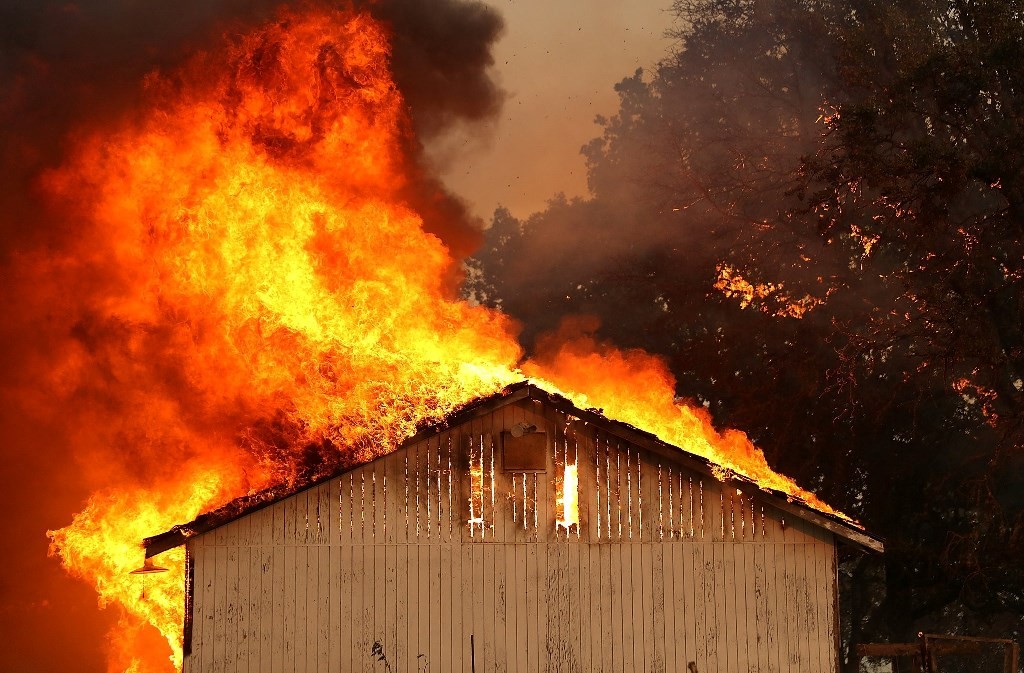 A home burns as the River Fire moves through Lakeport, Calif.CreditJustin Sullivan/Getty Images
