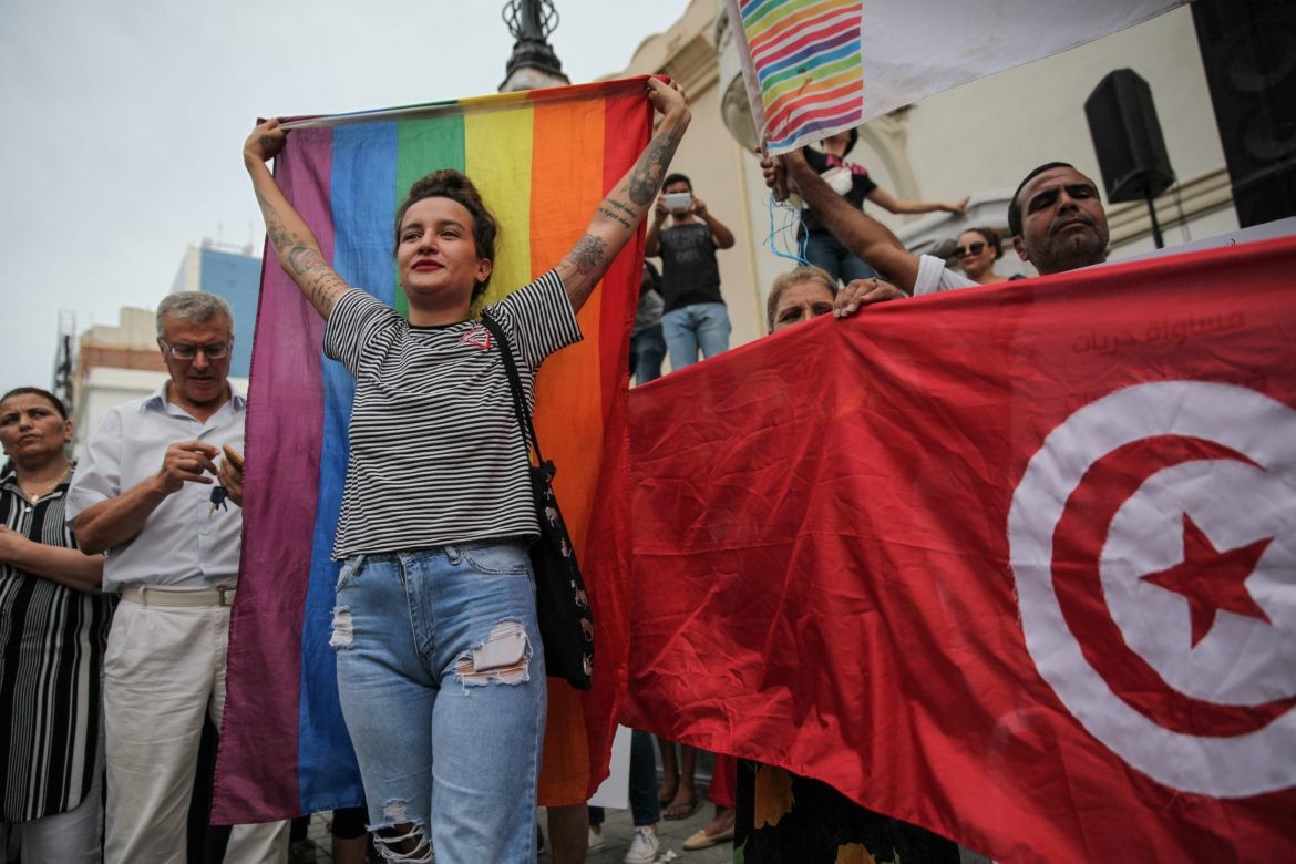 Amina Sboui, ex Femen rises the rainbow flag as she attends a demonstration held during the celebration of the National Womens Day in avenue Habib Bourguiba in Tunis, on August 13, 2018. Demonstrators called for gender equality, inheritance equality for women, LGBT rights and Tunisian womens rights. Demonstrators also protested against the Islamist Ennahda party and expressed their support to the Individual Freedoms and Equality Committee (COLIBE). Earlier in the day, Tunisian president, Beji Caid Essebsi a