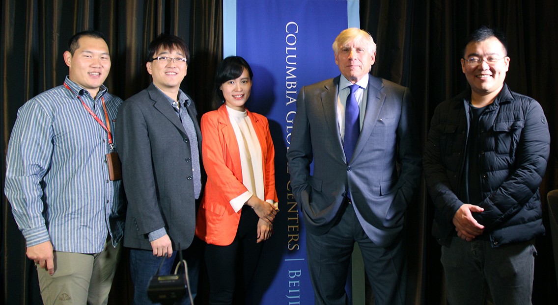 The Interview Crew of People's Daily Taking a Group Photo with President Lee C. Bollinger the interview crew of People's Daily taking a group photo with President Lee C. Bollinger