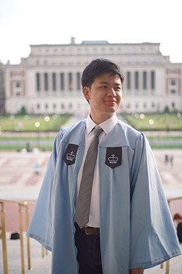 Graduation photo with Butler Library in the background.