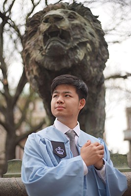 Graduation photo at the Scholar's Lion sculpture (credit to Jialu Cheng, PH'23)