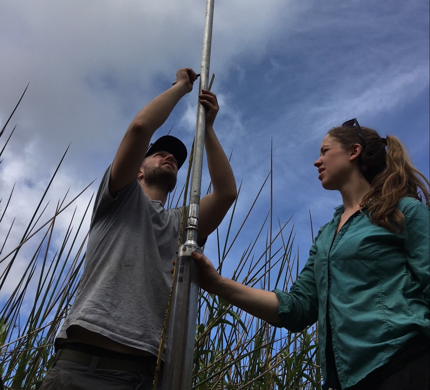 Billy D'Andrea and Lorelei Curtin preparing to collect a sediment core in Rano Aroi