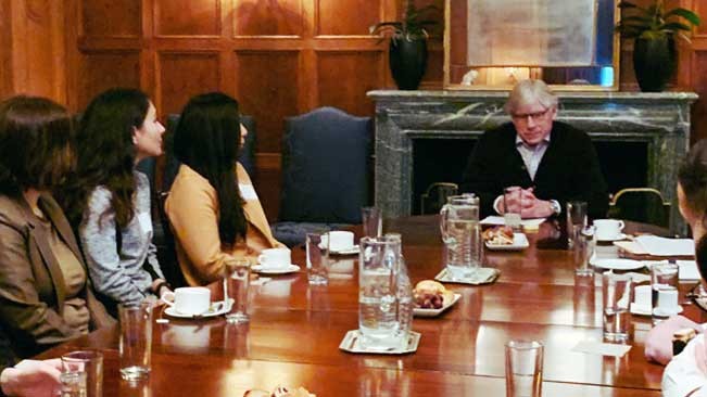 Shabnam Fayyaz, second from left, listens to Columbia University President Lee C. Bollinger