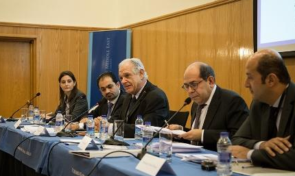 Five participants sitting at a panel in Amman, Jordan