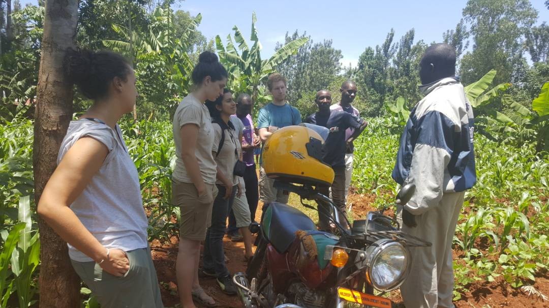 students with a model farmer in Sauri,Kisumu