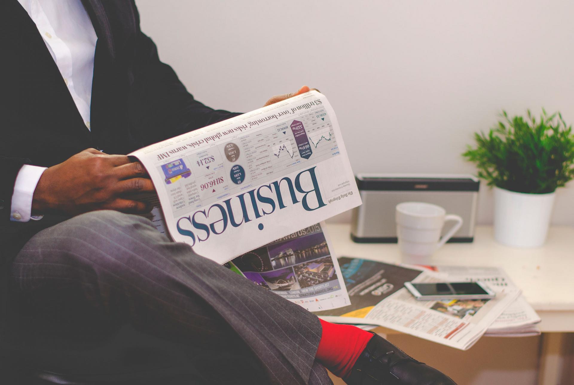 Man reading a business newspaper