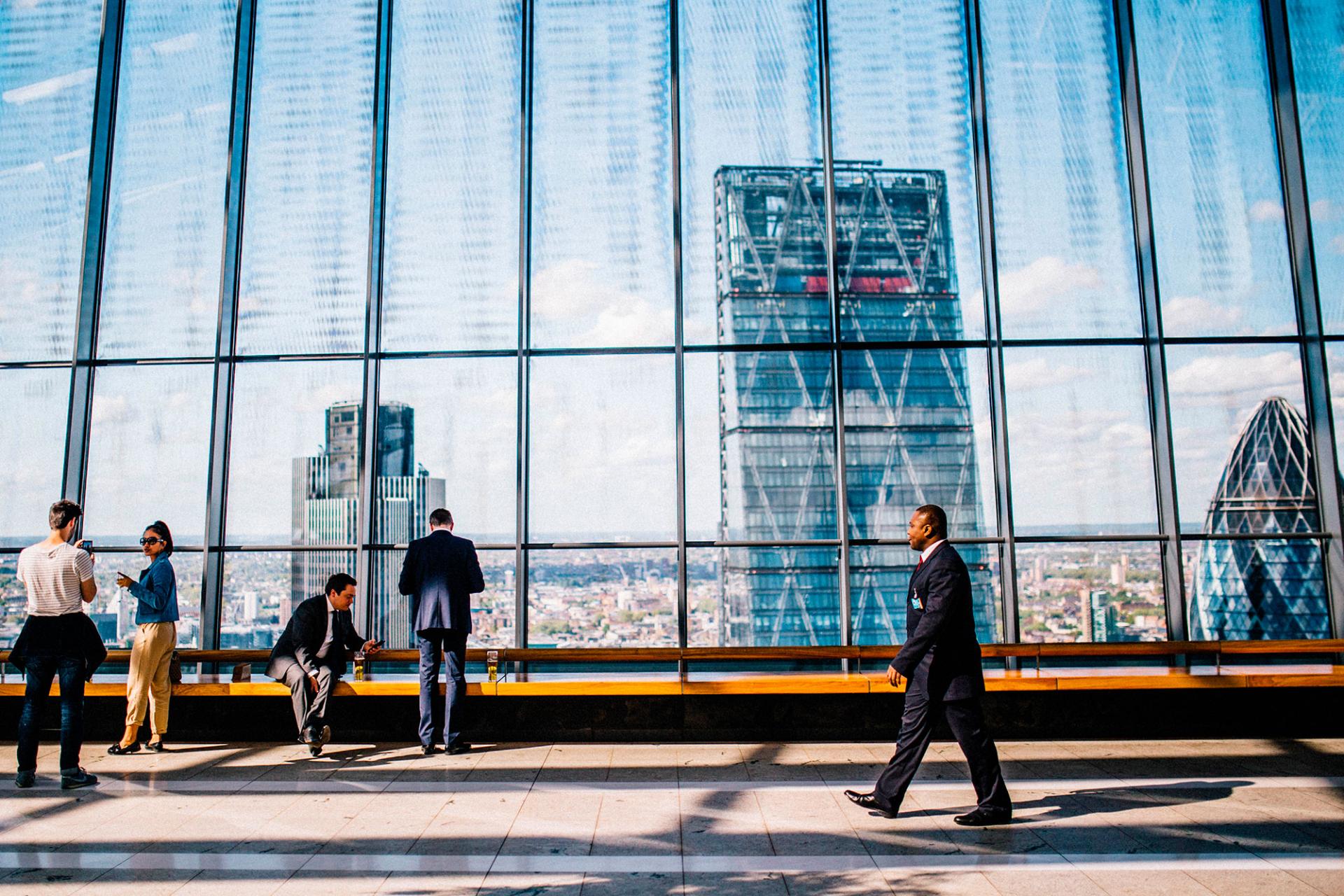 Man walking in front of building