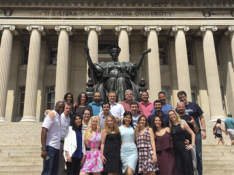 The Global EMPA class of 2017 in front of Alma Mater on campus, in New York. Monica Vianna is in the front, wearing a plaid dress. Photo: Maria Luiza Paranhos