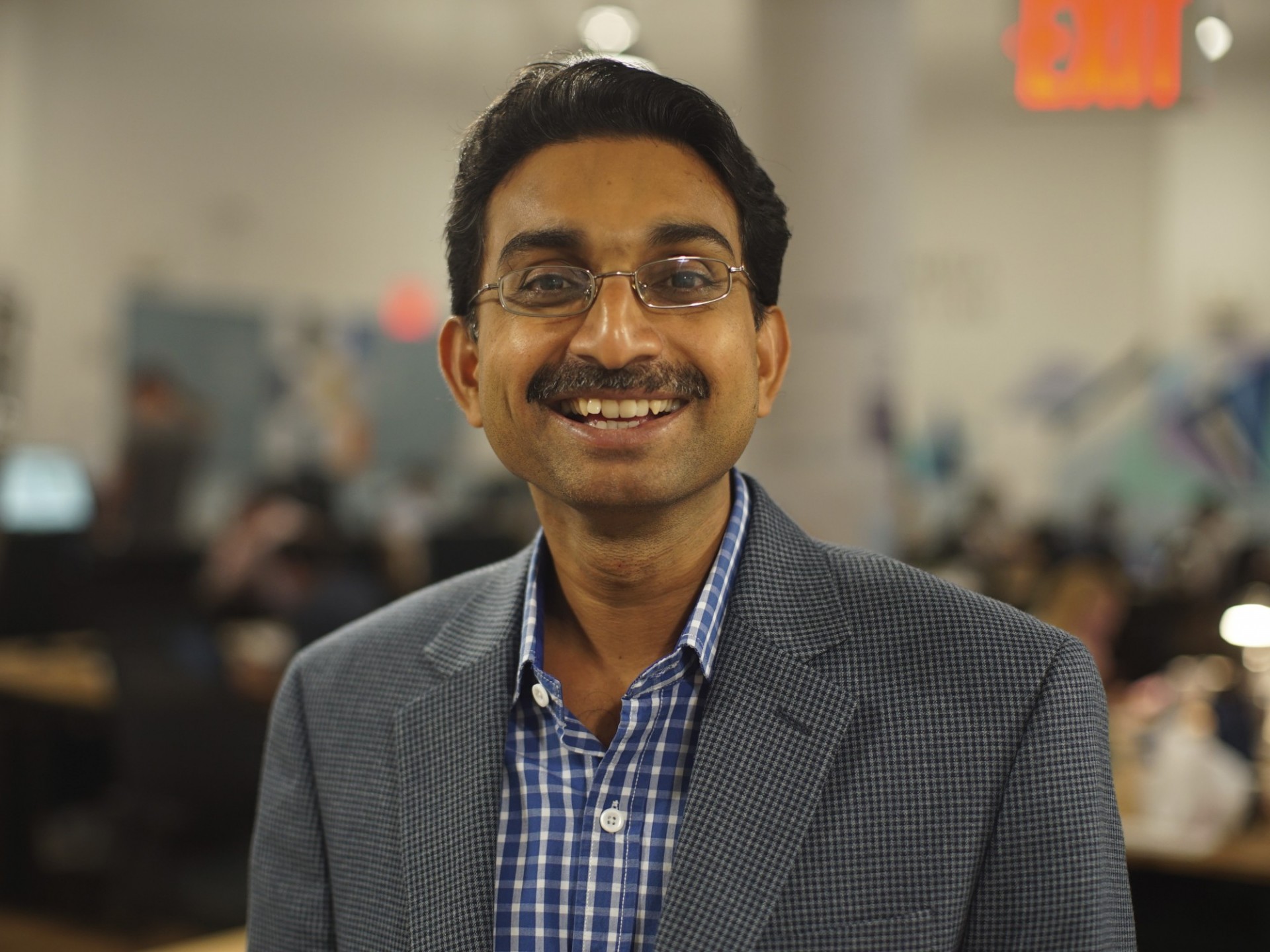 Professor Manoj Pooleery smiles to the camera.