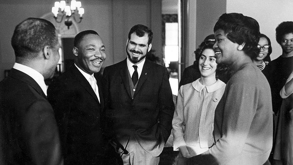 Martin Luther King Jr. with "Owl" editor Wally Wood (GS'88) (center) and other Columbia students in 1961. Photo by Lawrence J. Howell, courtesy of Wally Wood and Columbia University Archives.