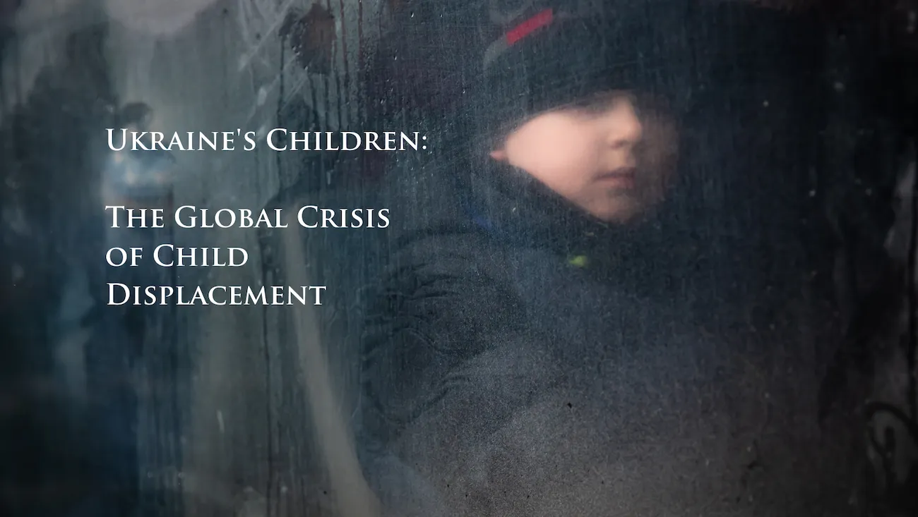 Photo of refugee Ukrainian child on bus fleeing his home