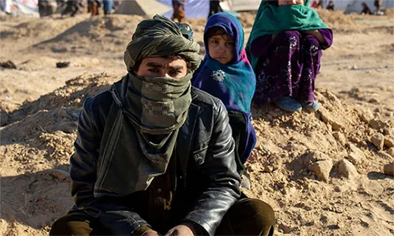 Man and child in Afghanistan (From CGC event Displacement, Citizenship, and the State: Afghanistan and the International System, Nov. 2, 2021)