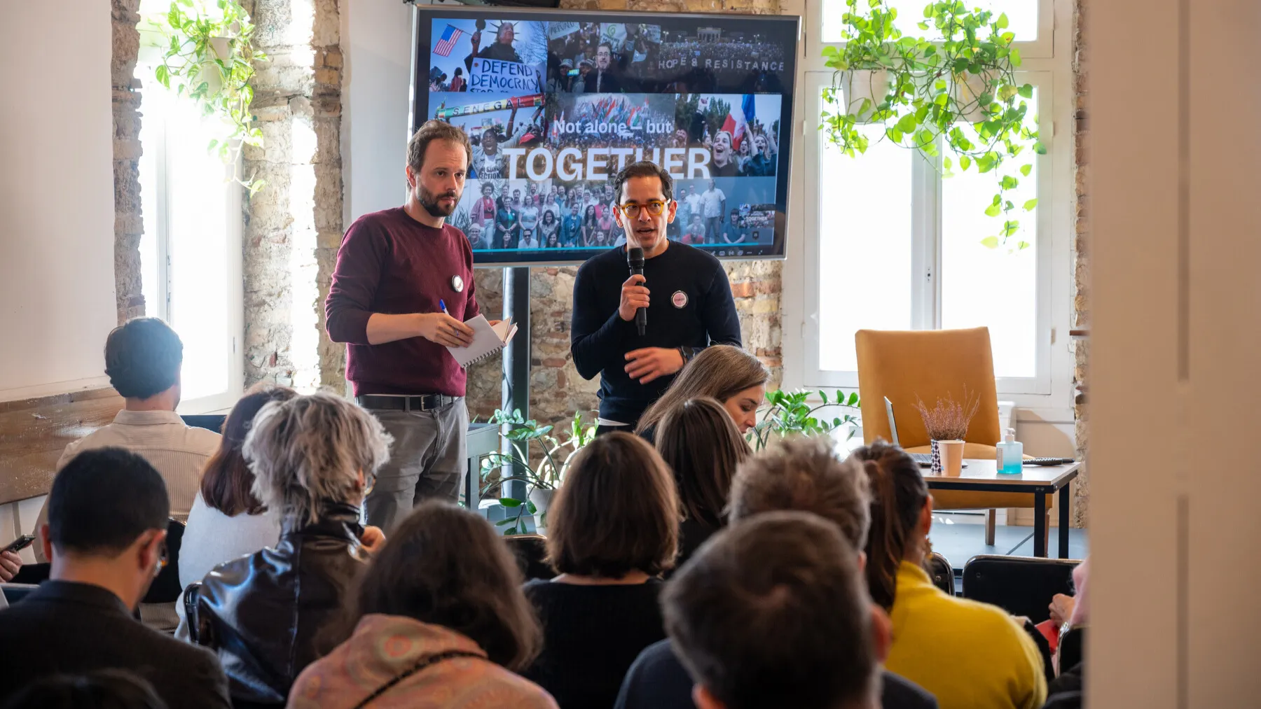 Democracy activists speaking at Athens event.