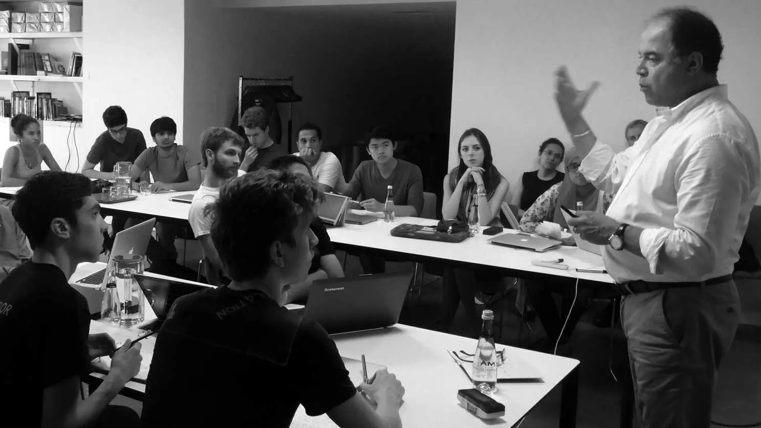students in a classroom at the Istanbul Center listening to a visiting professor