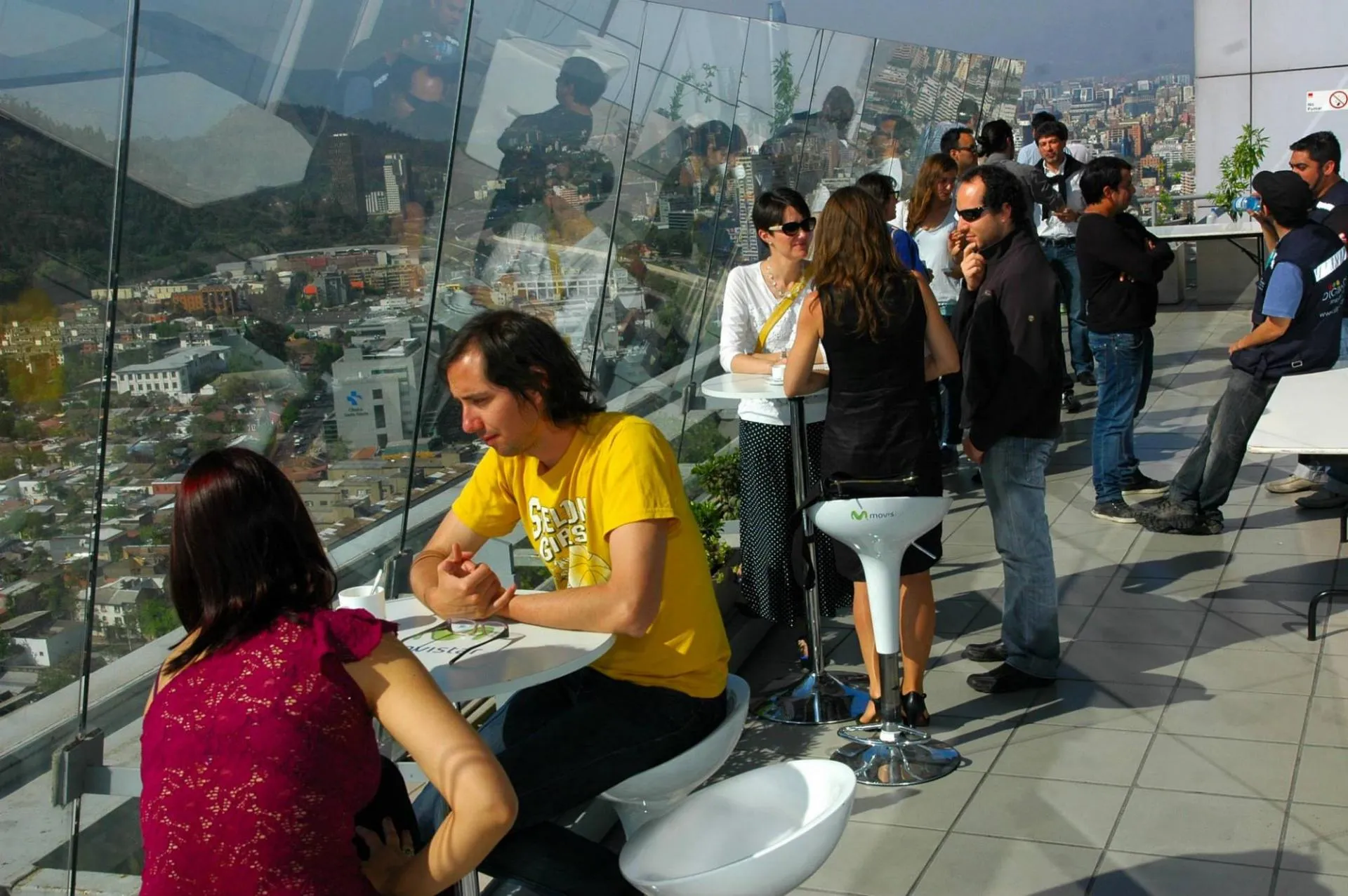 people on top floor of a building with glass windows in Santiago, Chile