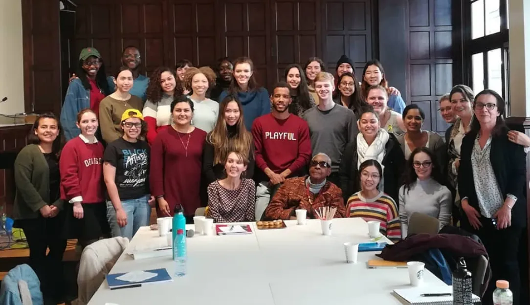 Maryse Condé (center, wearing sunglasses) with Columbia in Paris undergraduate students in the Salle de Conférence at Reid Hall.
