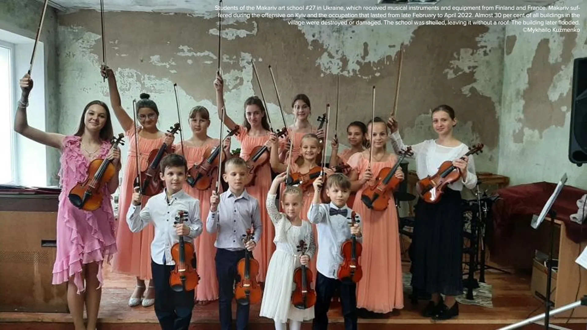 Students of the Makariv art school #27 in Ukraine, which received musical instruments and equipment from Finland and France. Makariv suffered during the offensive on Kyiv and the occupation that lasted from late February to April 2022. Almost 30 per cent of all buildings in the village were destroyed or damaged. The school was shelled, leaving it without a roof. The building later flooded. ©Mykhailo Kuzmenko 