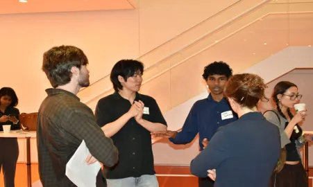 Attendees connect during the closing networking reception.