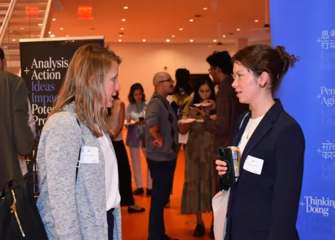 Attendees connect during the closing networking reception.