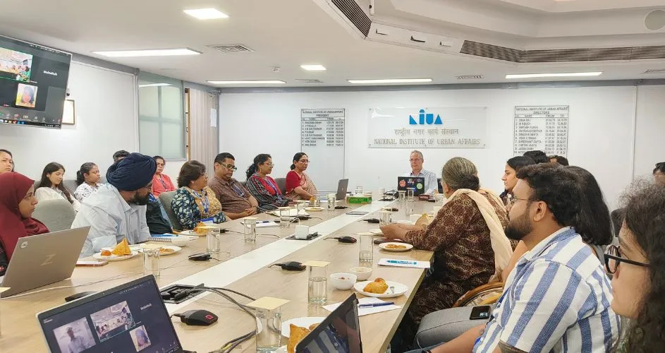 Dr Alex Sherbenin speaking in the conference room of the NIUA in New Delhi