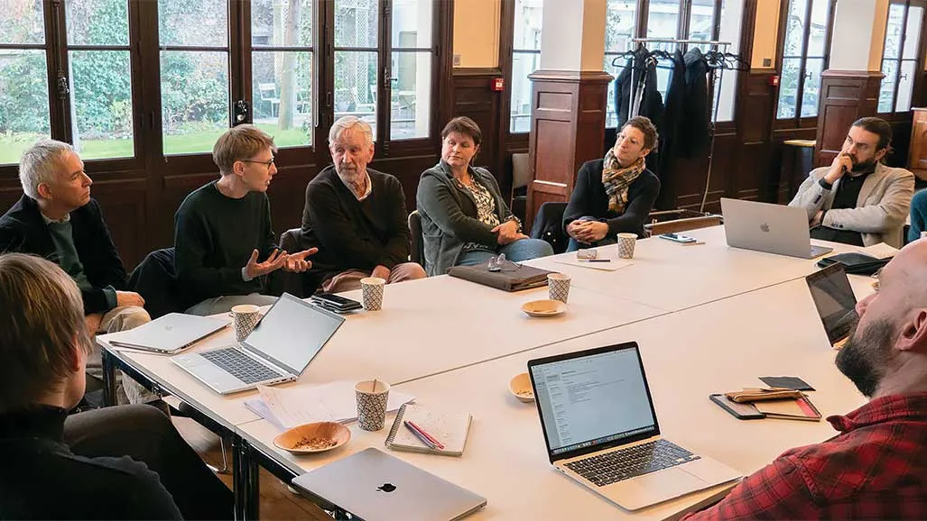 participants sit at a table during the narrative medicine workshop